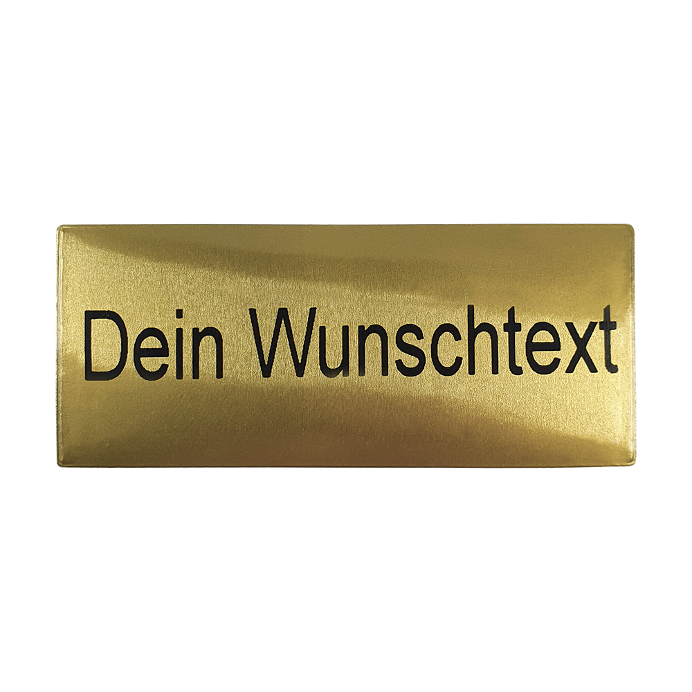 P-Schild_McDart_Pokalschild_mit_Wunschtext_1 Das Bild zeigt ein goldenes Pokalschild mit der Aufschrift „Dein Wunschtext“. Auf diesem Schild kann ein individueller Text eingraviert werden.