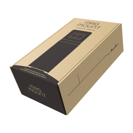 Die Abbildung zeigt eine Verpackung des Produkts "GranDarts GranEye Mag Mount Befestigung". Die Schachtel ist aus braunem Karton und trägt die Aufschrift "Mag Mount".