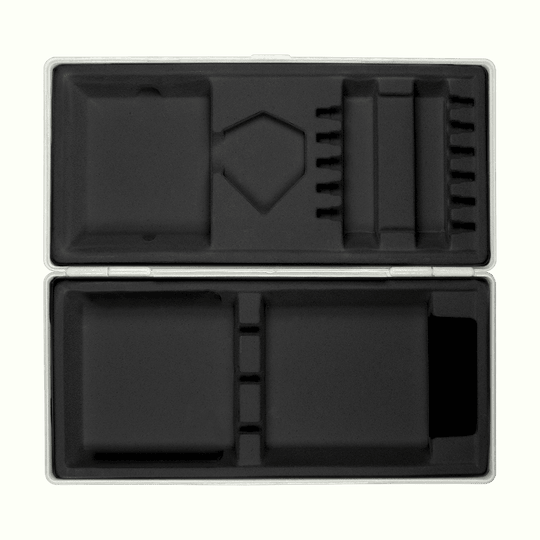 ABS box with custom print Die Abbildung zeigt eine geöffnete graue Box mit passgenauen Fächern aus schwarzem Schaumstoff. Die Box liegt auf einem hellgelben Hintergrund.
