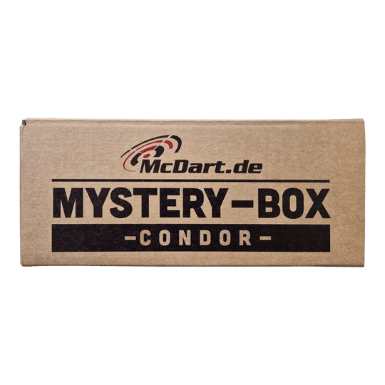 Auf dem Bild ist ein brauner Karton mit der Aufschrift "McDart.de Mystery-Box - Condor -" zu sehen. Die Schachtel wirkt geheimnisvoll und lädt zum Entdecken ein.